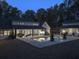 Expansive backyard with an in-ground pool, pool house, patio, and lush landscaping, perfect for outdoor living at 504 Trinity Church Rd, Canton, GA 30115