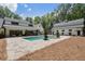 Stunning backyard with pool and spa perfect for outdoor entertaining and relaxation, with modern farmhouse architecture at 504 Trinity Church Rd, Canton, GA 30115