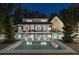 Nighttime view of the backyard with a sparkling pool and patio area, perfect for evening relaxation at 504 Trinity Church Rd, Canton, GA 30115