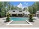 Stunning backyard featuring a modern in-ground pool, beautiful landscaping, and ample space for outdoor entertaining at 504 Trinity Church Rd, Canton, GA 30115