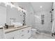 This bathroom boasts dual sinks, neutral finishes, and a tiled shower with marble accents at 504 Trinity Church Rd, Canton, GA 30115