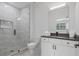 This modern bathroom boasts a sleek glass shower and neutral decor at 504 Trinity Church Rd, Canton, GA 30115
