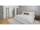 This spacious bedroom is adorned with wood flooring and neutral decor, creating a serene retreat at 504 Trinity Church Rd, Canton, GA 30115