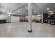 This large garage offers an epoxy floor and ceiling fans and lights for a functional space at 504 Trinity Church Rd, Canton, GA 30115