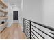 Hallway with natural wood floating shelves and black trim at 504 Trinity Church Rd, Canton, GA 30115