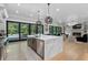Well-appointed open concept kitchen featuring quartz counters and easy access to backyard pool at 504 Trinity Church Rd, Canton, GA 30115
