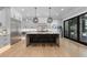 Elegant, modern kitchen with a large island, stainless appliances, and sleek, custom cabinetry at 504 Trinity Church Rd, Canton, GA 30115