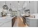 Modern kitchen with stainless steel appliances, a large island, and sleek gray cabinets at 504 Trinity Church Rd, Canton, GA 30115