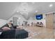 Expansive living room with vaulted ceilings, modern lighting, and a gray sectional at 504 Trinity Church Rd, Canton, GA 30115