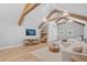 Light and airy living room showcases wooden beams, wood flooring, neutral decor and natural light at 504 Trinity Church Rd, Canton, GA 30115
