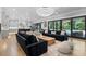 Open-concept living room with sliding glass doors and hardwood floors throughout the living spaces at 504 Trinity Church Rd, Canton, GA 30115