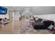Large living room with vaulted ceiling, gray sectional, and wall-mounted TV at 504 Trinity Church Rd, Canton, GA 30115
