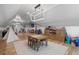 Spacious playroom featuring wood floors, table and chairs, and ample storage at 504 Trinity Church Rd, Canton, GA 30115