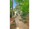 Gorgeous backyard with beautiful landscaping, and wood plank path leading up to the house at 118 Chelsea Dr, Decatur, GA 30030