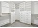 Spacious walk-in closet with custom white shelves and drawers offers ample storage at 118 Chelsea Dr, Decatur, GA 30030