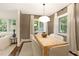 Sophisticated dining room with bright lighting, modern design, and hardwood floors at 118 Chelsea Dr, Decatur, GA 30030