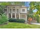 Charming two-story home featuring a well-manicured lawn and inviting front porch at 118 Chelsea Dr, Decatur, GA 30030