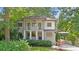 Charming two-story home with a welcoming front porch and well-maintained landscaping at 118 Chelsea Dr, Decatur, GA 30030