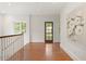 Bright upstairs hallway with hardwood floors leads to bedrooms and living spaces at 118 Chelsea Dr, Decatur, GA 30030