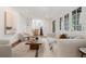 Spacious living room with sleek furniture, open staircase and plenty of natural light at 118 Chelsea Dr, Decatur, GA 30030