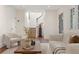 Inviting living room with neutral tones and staircase at 118 Chelsea Dr, Decatur, GA 30030