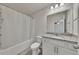 Bathroom with shower and tub combination with tile flooring and granite countertops at 320 Pebblestone Ln, Canton, GA 30115