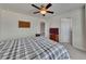 Bedroom with plush carpeting, ceiling fan, and ample natural light at 320 Pebblestone Ln, Canton, GA 30115