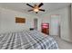 Bright bedroom features neutral walls, plush carpet, ceiling fan, and includes a TV and bureau at 320 Pebblestone Ln, Canton, GA 30115