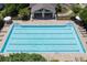 Beautiful community pool with tables, chairs, and lounge seating and a covered pavilion at 320 Pebblestone Ln, Canton, GA 30115