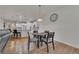 Open floor plan showcasing the dining area adjacent to a modern kitchen with white cabinetry at 320 Pebblestone Ln, Canton, GA 30115