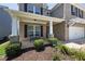Inviting front porch with brick facade, bench, and manicured landscaping at 320 Pebblestone Ln, Canton, GA 30115
