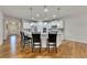 Open-concept kitchen with a large island, stainless steel appliances, and hardwood floors at 320 Pebblestone Ln, Canton, GA 30115