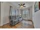 Comfortable living area with a plush sofa, ceiling fan, and bright windows offering ample natural light at 320 Pebblestone Ln, Canton, GA 30115