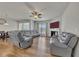 Spacious living room with hardwood floors, fireplace, and plush seating at 320 Pebblestone Ln, Canton, GA 30115