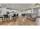 Spacious open-concept living area with modern kitchen, dining area, and comfortable seating at 320 Pebblestone Ln, Canton, GA 30115