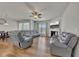 Open-concept living space with modern seating, a fireplace, and a view of the adjacent dining area at 320 Pebblestone Ln, Canton, GA 30115
