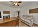 Spacious home office with hardwood floors, neutral walls, and a comfortable seating area at 320 Pebblestone Ln, Canton, GA 30115