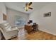 Bright office with hardwood floors, a large window, and a comfortable recliner at 320 Pebblestone Ln, Canton, GA 30115