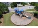 Aerial view of the community playground with slides and climbing structure on a wood chip base at 320 Pebblestone Ln, Canton, GA 30115