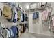Spacious walk-in closet with ample storage space and organized shelving for clothing at 320 Pebblestone Ln, Canton, GA 30115