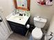 Bathroom featuring a blue vanity with white countertop and modern fixtures at 460 Heathrow Way, Stone Mountain, GA 30087
