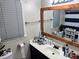 Bathroom with a wood-framed mirror and a vanity with white countertop at 460 Heathrow Way, Stone Mountain, GA 30087