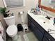 Bathroom featuring modern fixtures, a vanity with storage, and neutral decor at 460 Heathrow Way, Stone Mountain, GA 30087