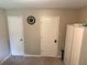 Bedroom with two doors, closet, and wardrobe, offering great storage at 460 Heathrow Way, Stone Mountain, GA 30087