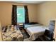 Inviting bedroom with a window, featuring two beds and soft carpet flooring at 460 Heathrow Way, Stone Mountain, GA 30087