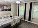 Dining area featuring a Paris themed wall picture with a ceiling fan at 460 Heathrow Way, Stone Mountain, GA 30087