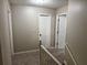 Hallway with carpeted floors and white trim at 460 Heathrow Way, Stone Mountain, GA 30087