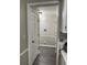 Hallway with a white door and trim leading to the dining area at 460 Heathrow Way, Stone Mountain, GA 30087