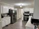 Spacious kitchen with stainless steel appliances and plenty of counter space at 460 Heathrow Way, Stone Mountain, GA 30087