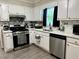 Kitchen featuring stainless steel appliances and ample counter space at 460 Heathrow Way, Stone Mountain, GA 30087